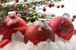 Red christmas balls in the snow