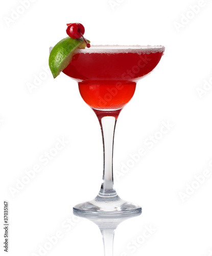 Photo: Glass of alcohol cocktail with lime and cherry isolated Glass of alcohol cocktail with lime and cherry isolated