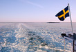 Swedish flag on boat in winter.
