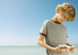 Boy holding starfish