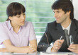 Woman speaking to businessman