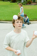 Boy juggling