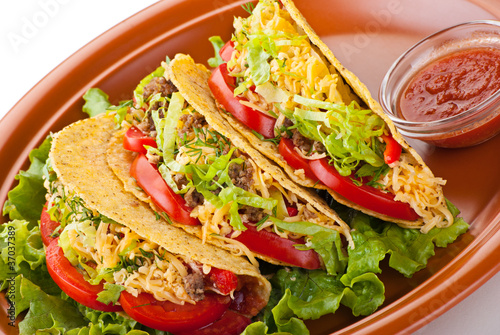 Photo: beef tacos with salad and tomatoes salsa beef tacos with salad and tomatoes salsa