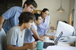 College students collaborating together using computers
