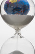 Hourglass, globe in background