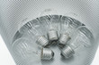 Conventional light bulbs in garbage can