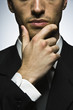 Foto: Businessman with hand under chin, portrait Businessman with hand under chin, portrait