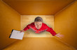 Sad mail courier inside empty box
