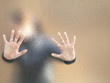 Silhouette of a girl through frosted glass