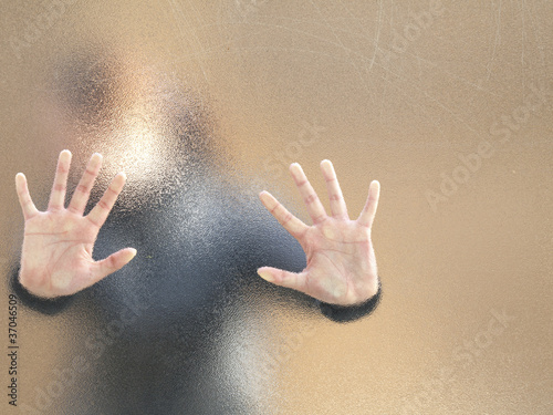 Photo: Silhouette of a girl through frosted glass Silhouette of a girl through frosted glass