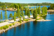 A road crossing blue lakes in Finland