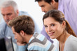 Young woman with male colleagues