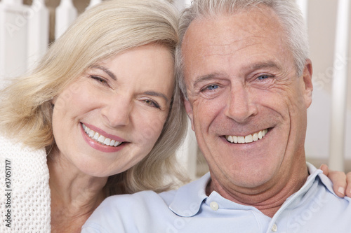 Photo: Happy Senior Man & Woman Couple Smiling at Home Happy Senior Man & Woman Couple Smiling at Home