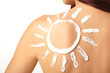 woman with sun-shaped sun cream