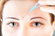 cosmetic injection of botox to the face of beautiful woman