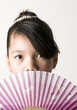 Photo: Girl Hiding Behind Fan Girl Hiding Behind Fan