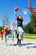 Photo: Teenagers playing basketball Teenagers playing basketball