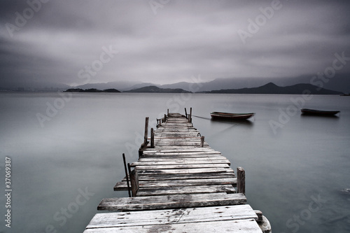 Photo: pier and boat, low saturation pier and boat, low saturation
