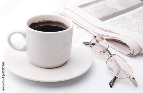 Photo: Eyeglass and newspaper Eyeglass and newspaper