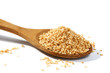 Sesame grains in large wooden spoon Sesame grains in large wooden spoon