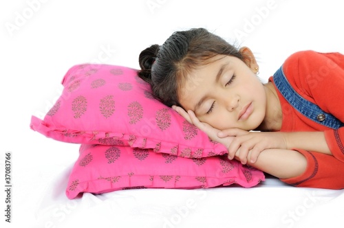 Photo: Indian Girl sleeping over pillow. Indian Girl sleeping over pillow.