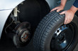 mechanic changing a wheel of a modern car