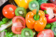 Varicoloured fruit and vegetables lie on a dish