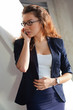Photo: Young woman talking on the phone Young woman talking on the phone
