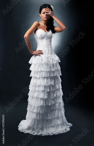 Photo: Bride brunette in bridal dress Bride brunette in bridal dress