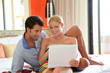 Couple in hotel room connected on internet