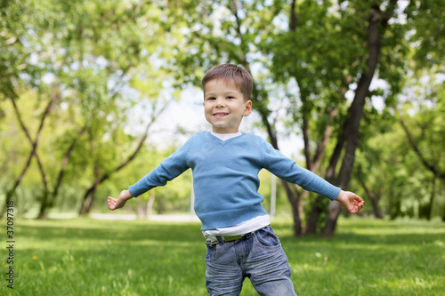Photo: Portrait of a little boy outdoors Portrait of a little boy outdoors