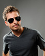 Confident young man in sun glasses