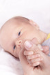 baby holding mothers finger