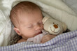 Baby mit Teddybär
