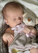 Baby mit Teddy