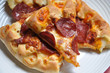 image of pizza sliced on the plate image of pizza sliced on the plate