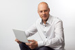 Portrait of middle-aged man with a white laptop computer