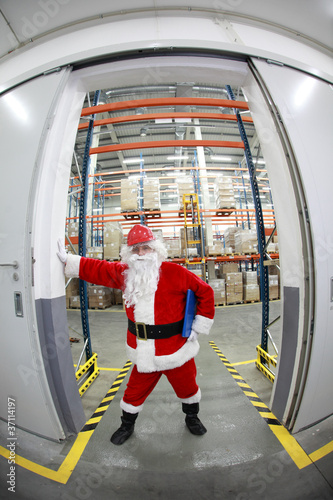 Photo: Santa Claus gate keeper to storehouse with gifts Santa Claus gate keeper to storehouse with gifts
