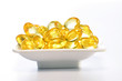 Photo: Cod liver oil pills in a white bowl Cod liver oil pills in a white bowl