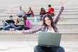 students on campus working outdoors
