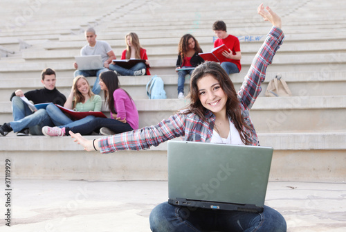 Photo: students on campus working outdoors students on campus working outdoors