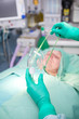 Photo: Patient being fitted with mask for operation Patient being fitted with mask for operation