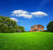 Foto: Green landscape and new house Green landscape and new house