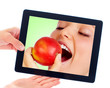 Tablet computer and woman with apple Tablet computer and woman with apple