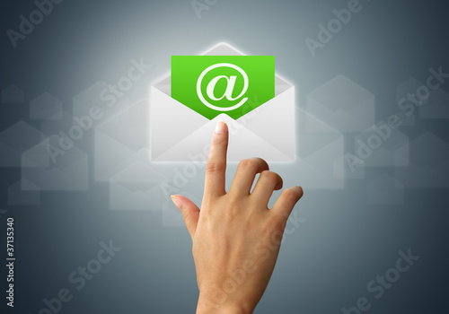 Photo: The hands of a feminine touch on the envelope and mail The hands of a feminine touch on the envelope and mail