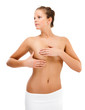 Woman examining her breast isolated on white