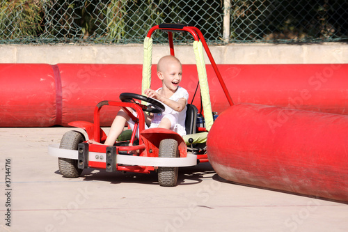 Photo: child on go cart child on go cart