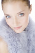 Portrait of a young woman wearing a feather shrug, close-up