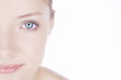 A young woman showing the left half of her face, cropped