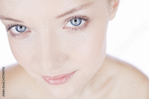 Photo: Portrait of a young woman with blue eyes, cropped Portrait of a young woman with blue eyes, cropped
